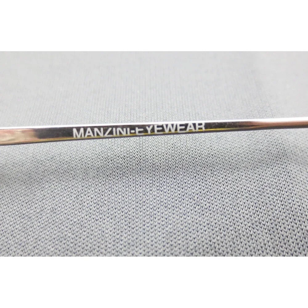 Manzini Eyewear Sea Mist 108 Titanium Oval Silver Frames 51-16-140 Demo Lenses